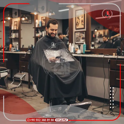 رداء حلاقة يحمل شعار — EBDAA